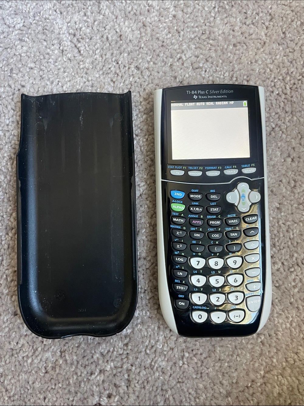 Texas Instruments Graphing Calculator in Black and Silver